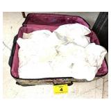 SUITCASE FULL OF WHITE SHEETS