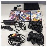 PlayStation 2 Slim w/ Games, Remotes & Power Cords