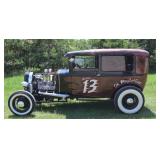 with a 1933 Flathead Ford V8>