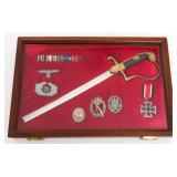 WWII GERMAN CUT LIONHEAD SWORD, MEDALS & BADGES