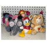 Group of Disney plush & Small Carebear