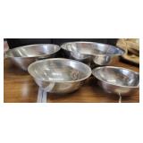 Set of 4 stainless mixing bowls.