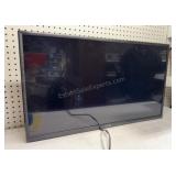 VIZIO 32 inch turns on