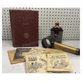 Magnifying glass, flask, Booklets & Maps