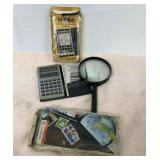 Vintage TI-1766 calculator and magnifying glass