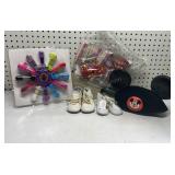 Crafts, baby shoes, and Mickey Mouse hat