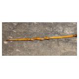 hand-carved wooden walking stick featuring a