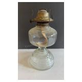 vintage oil lamp features a clear glass pedestal
