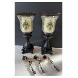 Pair of black decorative pedestal candle holders