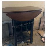 counter-height round drop-leaf storage table with