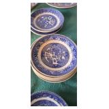 Assorted blue ceramic China plates and bowls. A