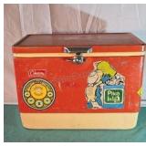Vintage red Coleman metal cooler with era