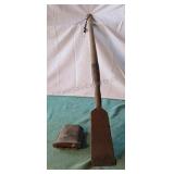 Antique timber framing chisel with leather sleeve.