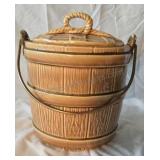 Ceramic cookie jar with metal handle.  Appears to