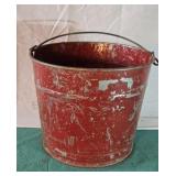Galvanized bucket. Chipping red paint and 5 slit
