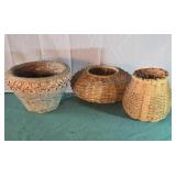 Wicker flower pot baskets.