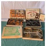 Vintage cookie cutters in original boxes.