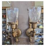 Electric wall scones with etched glass shades.