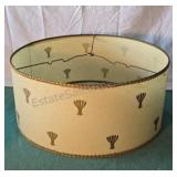 Vintage cream colored lamp shade with gold trim.