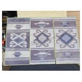 Framed set of Native American pattern cloth art.