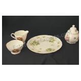 Mismatched plate, creamer and sugar bowls