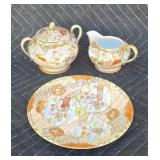 Hand painted plate, creamer and sugar bowl.