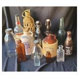 Sorted glass bottles and ceramic jugs