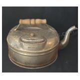 Vintage copper tea kettle with wooden handle.
