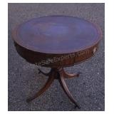 Vintage mahogany drum table featuring an inlaid