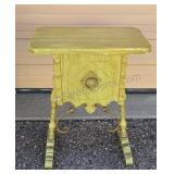 Ornate side table with insulated storage.