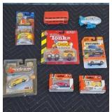 Assorted die-cast toy cars. Some in blister packs