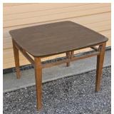 Mid century walnut side table with Formica top.