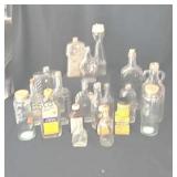 Assorted glass bottles. Some with corks and