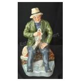 Royal Dalton "A Good Catch" figurine. 7ï¿½ins.