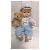 11 inch porcelain boy sitting with teddy bear