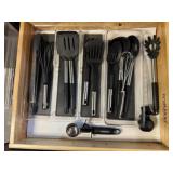 Contents of utensil drawer, spatulas, tongs, scoop