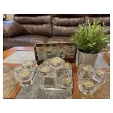 Party light, glass candle holders, greenery