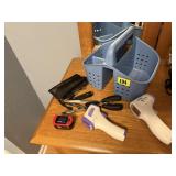 Tote of digital thermometers, pulse oximeter,