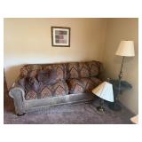 Couch, lamps, & wall hanging
