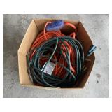 Box of extension cords and power strip