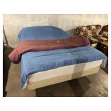 Queen size bed with bedding