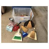 Tote of hand brooms, dustpans, brushes, clips