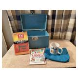 Vintage train case, books, mug, cosmetic bag
