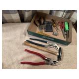 Needle nose pliers, screwdrivers, hand tools