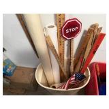 Yardsticks, rolls of paper, flag