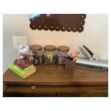 Storage jars, paper punch, desk accessories