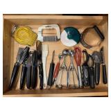 Contents of utensil drawer, can openers, slicers,