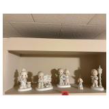 Shelf of Precious Moments collectibles