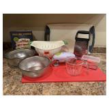 Kitchen lot, colanders, cookbook, cutting boards