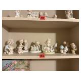 Shelf of Precious Moments collectibles